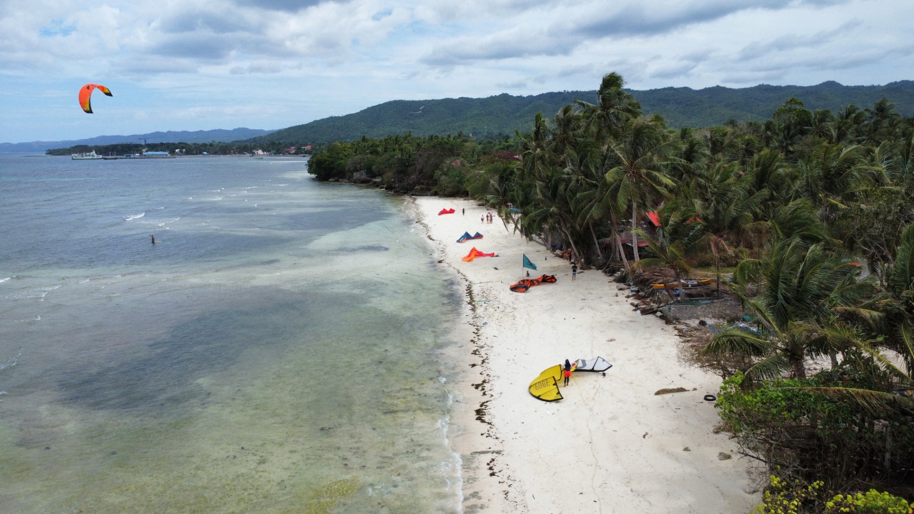 Aerial view of an empty turquoise lagoon and white sandbar in Siquijor